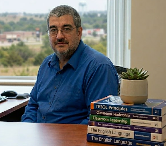 David Lane at his desk with a stack of TESOL and English language books